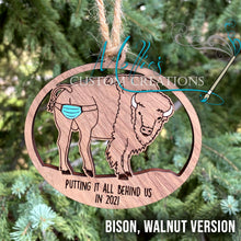 Load image into Gallery viewer, 2021 Covid Mask Ornament: Putting it all behind us, Bison / Buffalo version | Wooden Christmas ornament | Masks on Butt
